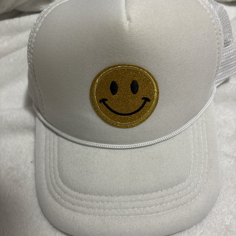 White Cap with Gold Smiley Face